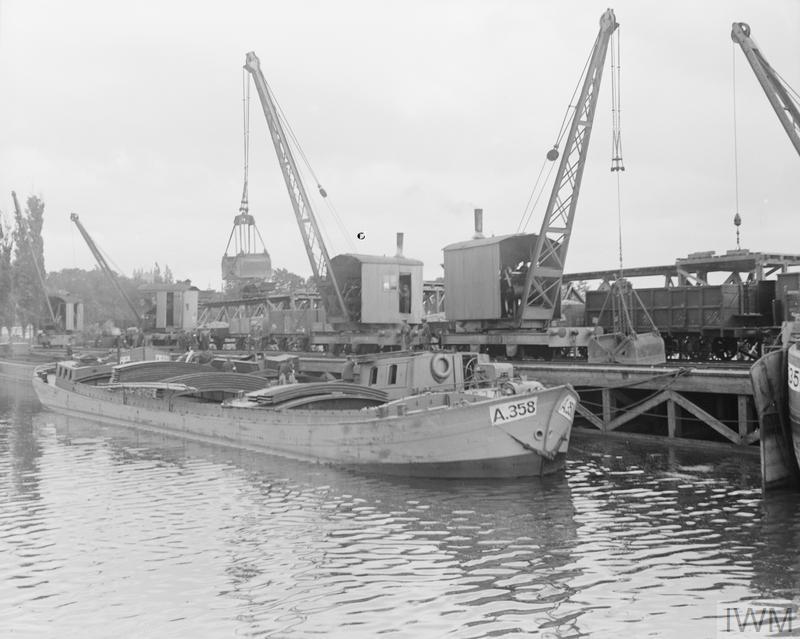 A barge unloading at a quay on the canal at Bergues, France, 23<sup>rd</sup> August 1917